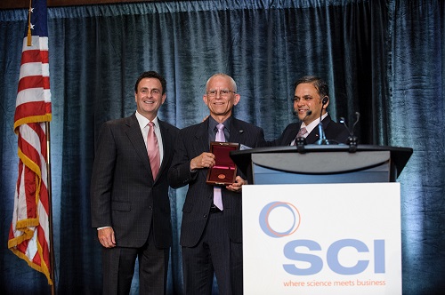 Peter Trefonas, accepts the 2016 Society of Chemical Industry (SCI) Perkin Medal. Pictured alongside Trefonas are Fred Festa, chairman and chief executive officer of W.R. Grace & Co. and chair of SCI America, and A.N. Sreeram, Dow senior vice president, R&D, and chief technology officer.